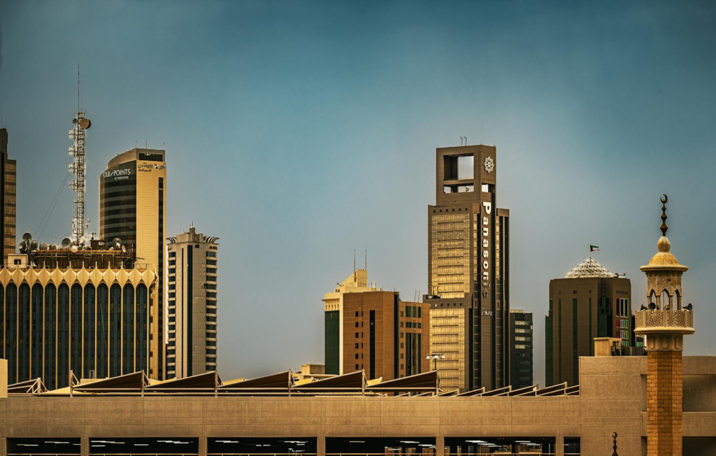 Skyline view of Kuwait City showcasing modern skyscrapers and traditional architecture.