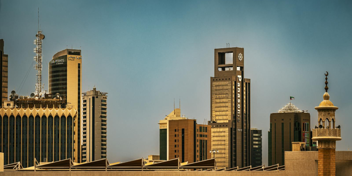 Skyline view of Kuwait City showcasing modern skyscrapers and traditional architecture.
